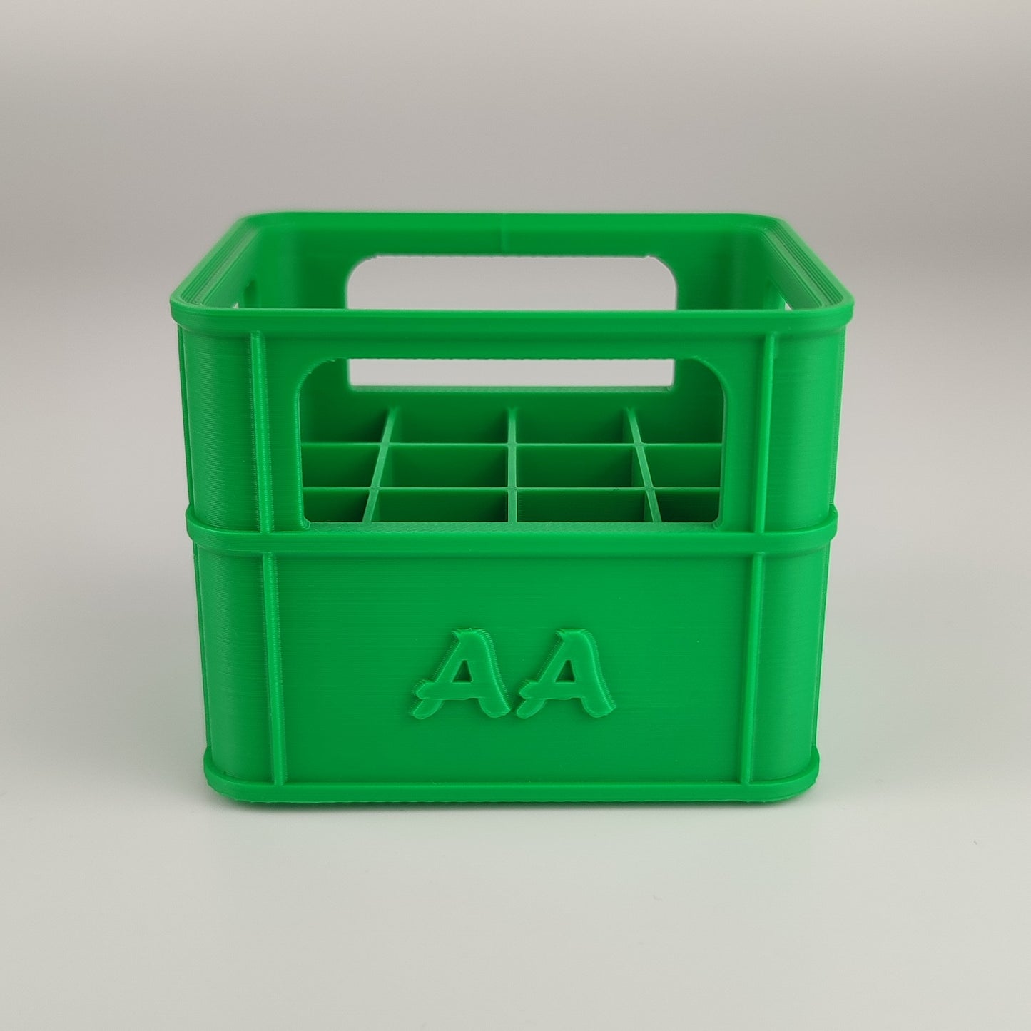 Batteriekiste für AA-Batterien in der Farbe Grün.