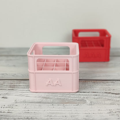 Batteriekiste für AA-Batterien in der Farbe Pfirsich Rosa.
