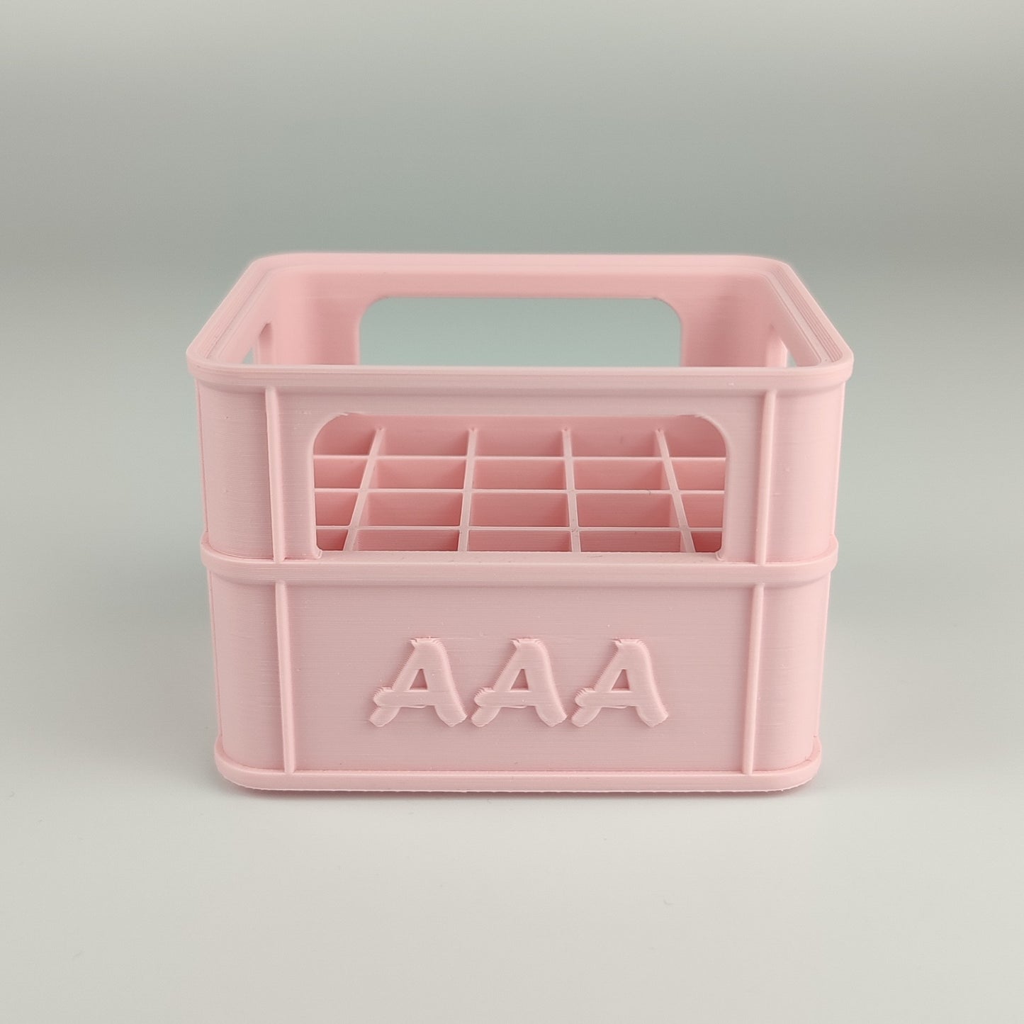 Batteriekiste für AAA-Batterien in der Farbe Pfirsich Rosa.