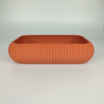 Große Dekoschale in der Farbe Terrakotta.